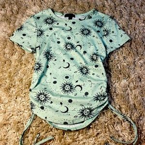 Green graphic crop top.